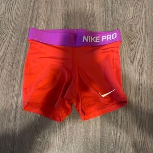 Nike pros, red and purple, size small